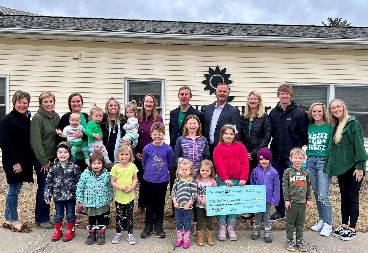 Sunflower staff, children and Bank CEO Ben Grimstad Sunflower staff, children and Bank CEO Ben Grimstad